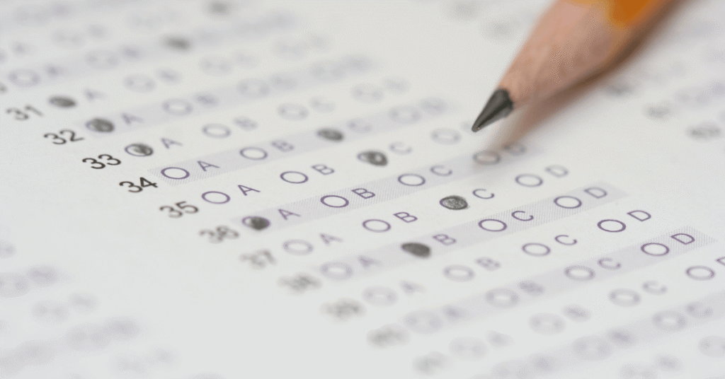 Student taking an exam after saying a Christian prayer for wisdom, peace, and confidence.