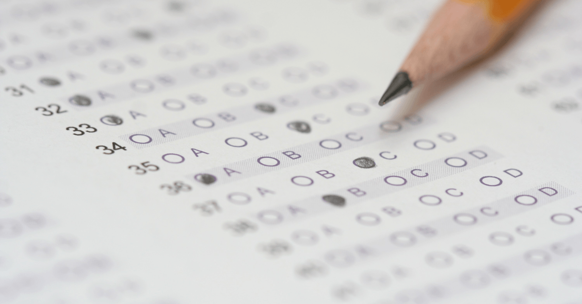 Student taking an exam after saying a Christian prayer for wisdom, peace, and confidence.