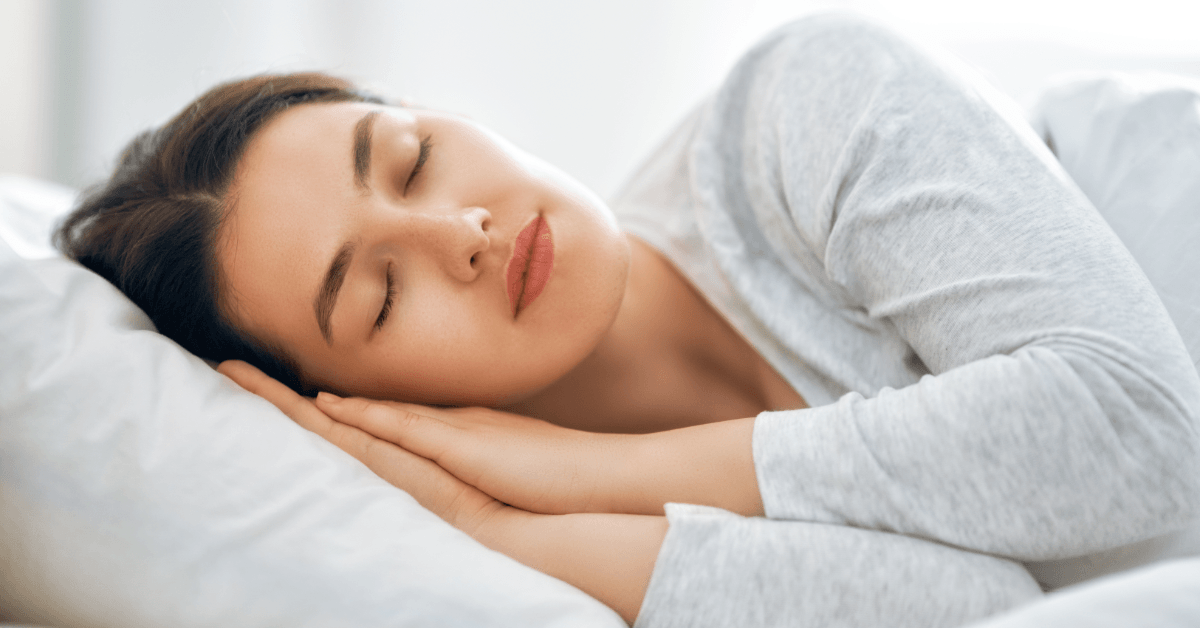 Woman peacefully sleeping after saying a Christian Prayer for Sleep before bedtime.